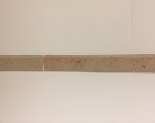 Bathroom border in Corton limestone