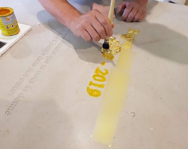 Gold leaf - Letters engraved on tombstone Gold leaf - Letters engraved on tombstone