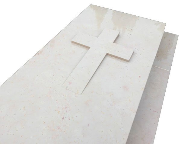 Tombstone with cross carved in the mass