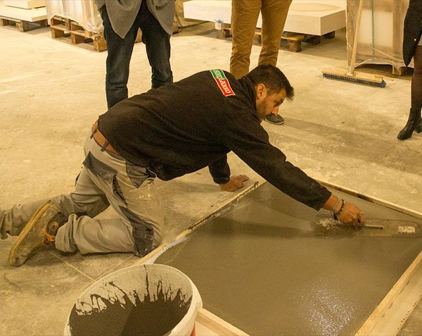 Self-leveling compound for concrete slabs.