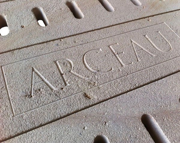 Engraving on Burgundy limestone gutter Engraving on Burgundy limestone gutter