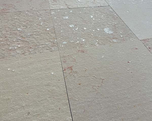 Outdoor flooring in natural limestone with a flamed finish