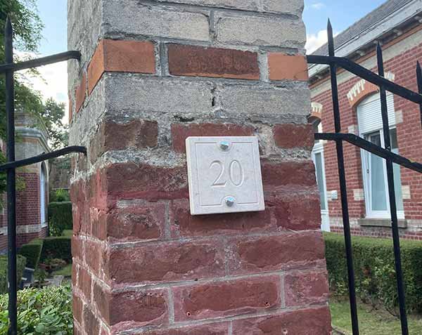 Street number in natural limestone