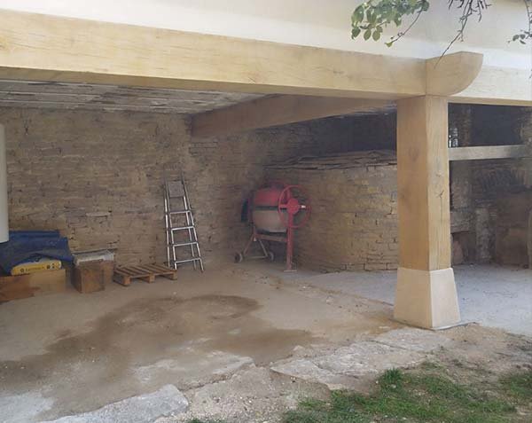 Wooden pillar with base in natural limestone