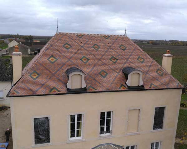Custom natural stone roof dormer