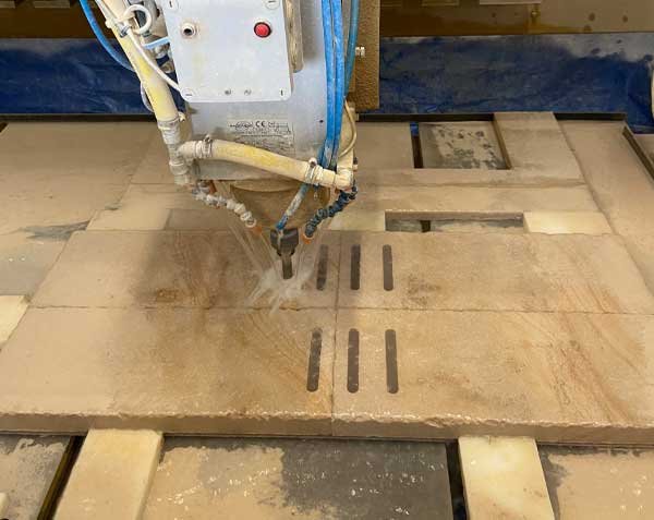 Machining of perforated natural stone drainage channel for water flow Machining of perforated natural stone drainage channel for water flow